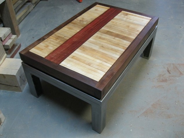Structural Aesthetics Local black walnut with reclaimed bowling alley and eucalyptus on custom steel base.