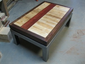 Structural Aesthetics Local black walnut with reclaimed bowling alley and eucalyptus on custom steel base.